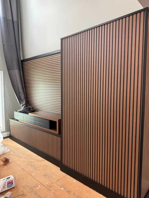 Slatted timber feature wall built out around a media unit